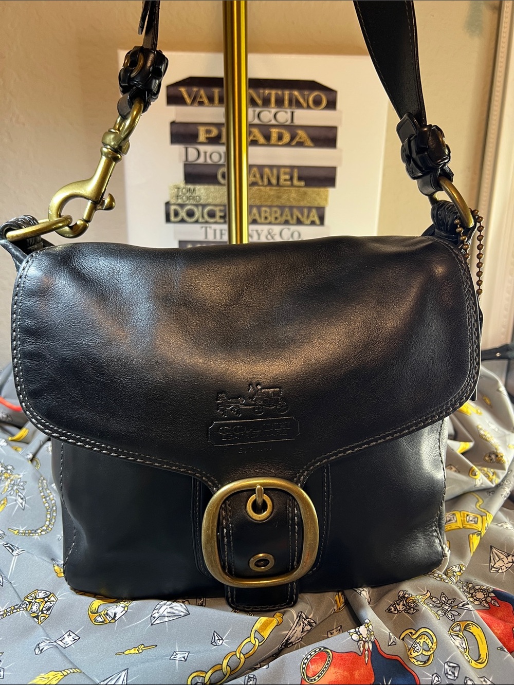 Coach “Bleecker” Leather shoulder bag with deep exterior back slip pocket
